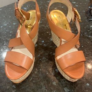 7.5 Michael Kors brown wedges.